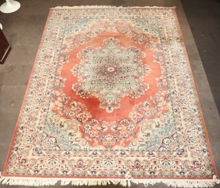 A light brown, green and white ground machine made Persian style carpet 358cm x 275cm 