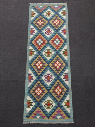 A turquoise and green ground Maimana Kilim runner with all over geometric designs 208cm x 69cm 