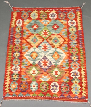 An orange, white and green ground Chobi Kilim with all over diamond decoration 117cm x 84cm 