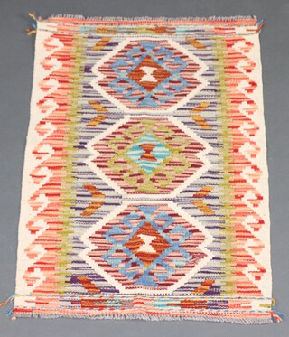 A white, green and turquoise ground Chobi Kilim with 3 medallions to the centre 88cm x 58cm 