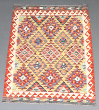 A white, orange and green ground Chobi Kilim rug with diamond design to the centre 143cm x 100cm 