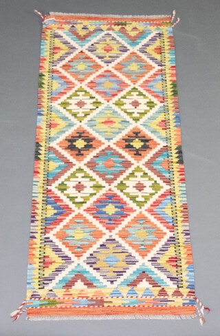 A white, green and turquoise ground Chobi Kilim runner 156cm x 65cm 