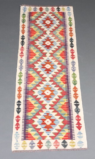 A white, turquoise and green ground Maimana Kilim runner with diamonds to the centre 192cm x 66cm 