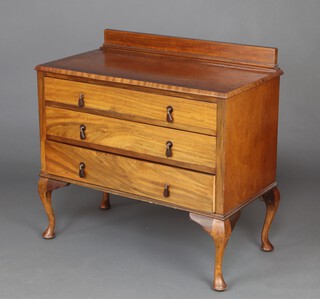 A 1930's Art Deco crossbanded mahogany chest with raised back fitted 3 drawers, raised on cabriole supports 87cm h x 90cm w x 48cm d 