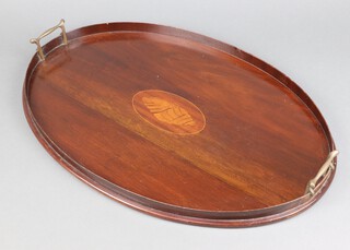 An Edwardian oval mahogany twin handled tea tray with inlaid decoration of a shell 4cm h x 60cm w x 40cm d 