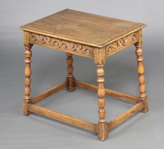 A 17th Century style carved light oak occasional table, raised on turned supports 57cm h x 60cm w x 44cm d 