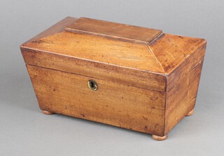 A 19th Century rectangular mahogany sarcophagus shaped tea caddy on bun feet 11cm h x 24cm w x 13cm d 