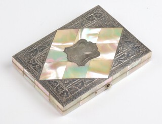 A white metal mounted mother of pearl purse 