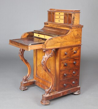 A Victorian rosewood piano top Davenport with rising stationery box, the pedestal fitted 4 drawers with turned handles 110cm h x 57cm w x 57cm d 