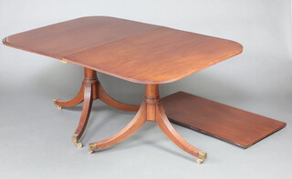 A Georgian style snap top, twin pillar mahogany extending dining table with 1 extra leaf, raised on pillar and tripod supports with extra leaf 71cm h x 105cm w x 156cm l x 209cm l when extended (no bearers) 