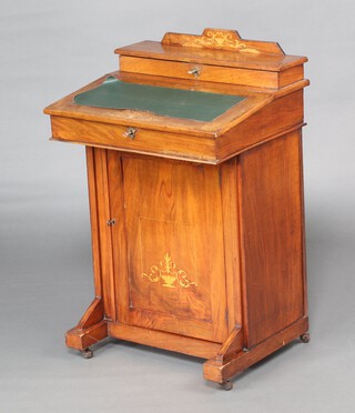 A late Victorian inlaid mahogany Davenport with stationery box to back, hinged lid revealing a plain interior, the pedestal enclosed by a panelled door 82cm h x 52cm w x 43cm d 