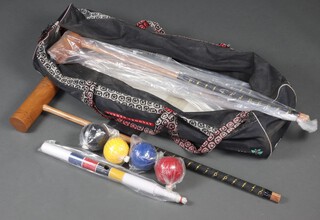 An Uber croquet set comprising 4 balls, peg, 4 mallets, 6 hoops, mallet hoop, as new 