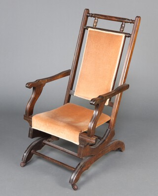 A 19th Century beech framed American rocking chair 101cm h x 53cm w x 51cm d 