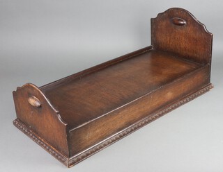 A 1930's rectangular oak cot 30cm h x 69cm w x 31cm d 