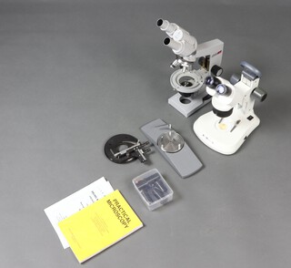 A Brunel microscope together with a Nomo ditto and accessories