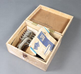 A Marples mitre cutter (boxed) and a Record Dowling jig (boxed) and both contained in a wooden box 