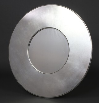 A circular plate mirror contained in a silver coloured frame 90cm diam. 