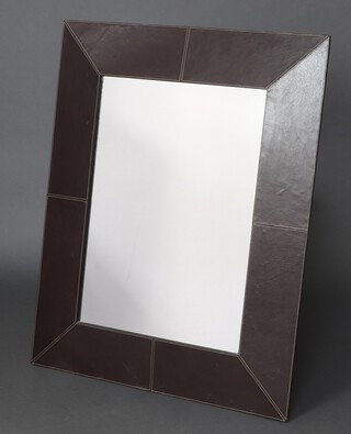 A rectangular plate mirror contained in a leather effect frame 101cm x 80cm 