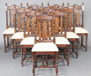 Ten, 1930's style oak slat back dining chairs with over stuffed seats, raised on turned supports with H framed stretchers 108cm h x 47cm w x 43cm d 