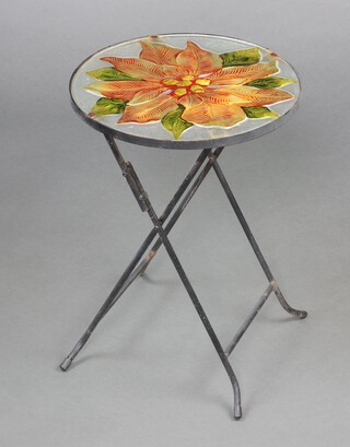 A circular metal and glass folding table, the top decorated a leaf 50cm h x 35cm diam. 