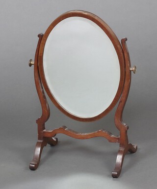 A 19th Century style oval bevelled plate dressing table mirror contained in an inlaid mahogany swing frame 57cm h x 25cm w x 33cm d 