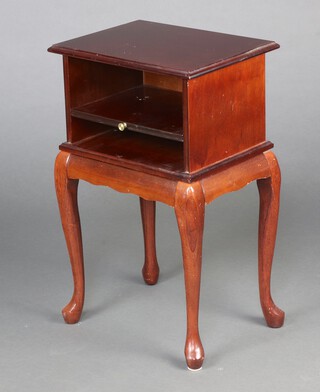 A rectangular mahogany bedside cabinet fitted a brushing slide, raised on cabriole supports 65cm h x 40cm w x 31cm d 