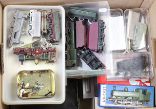 A collection of part built aluminium locomotives, contained in a cardboard box 