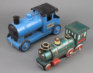 A blue painted Triang Puff Puff Express together with a Japanese tin plate battery operated Western locomotive 