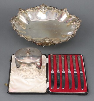 A silver plated pedestal bowl, ditto tea caddy and 6 butter knives 