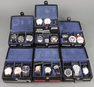 Twenty gentleman's fashion wristwatches, contained in display cases (sold as seen and may require new batteries)