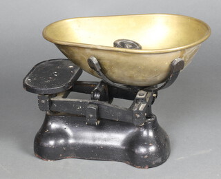 An iron pan scale together with various weights 31cm h x 41cm w x 28cm d 