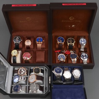 Twenty gentleman's fashion wristwatches, contained in display cases (sold as seen and may require new batteries) 