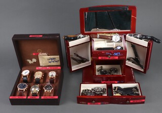 Twenty gentleman's fashion wristwatches, contained in display cases (sold as seen and may require new batteries) 