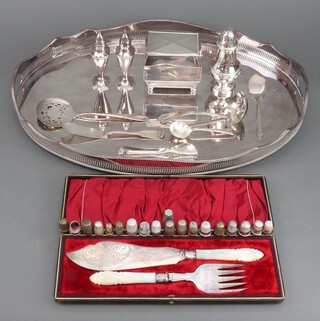 A pair of silver plated and mother of pearl fish servers, an oval tray and minor plated wares