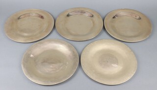 Five polished bronze platters 29cm 