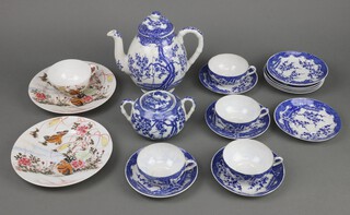 A Japanese blue and white porcelain tea set comprising teapot, sugar bowl, 4 cups, 10 saucers, tea cup and 2 plates