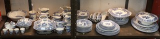 A Wood and Sons Yuan pattern tea and dinner service comprising tureen and stand, 4 tureens, 3 gravy boats, coffee pot, milk jug, small jug, tea pot (no lid), 6 tea cups, 11 saucers, 3 small side plates, 7 side plates, 12 medium plates, 6 large plates, 6 medium plates, pot stand, 3 serving plates, 1 large serving plate, 1 soup bowl, 8 cereal bowls, 4 egg cups, sugar pot, small jug and pot