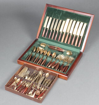 A canteen of Thai gilt bronze flatware contained in a teak canteen box together with a tray of Thai gilt bronze flatware