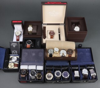 Twenty gentleman's fashion wristwatches, contained in display cases (sold as seen and may require new batteries)