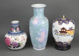 An Antique style Chinese jar and cover decorated with pavilions 31cm, ditto vase 45cm and a baluster ditto 28cm 