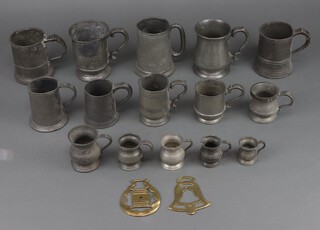 A collection of Georgian and later pewter mugs 