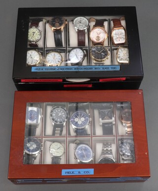 Twenty gentleman's fashion wristwatches, contained in display cases (sold as seen and may require new batteries)