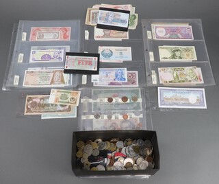 A quantity of world coins and banknotes