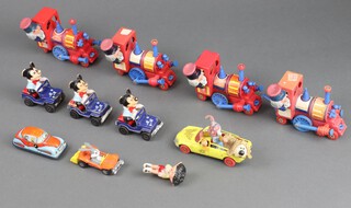 A collection of Corgi and Lesney Magic Roundabout figures in vehicles