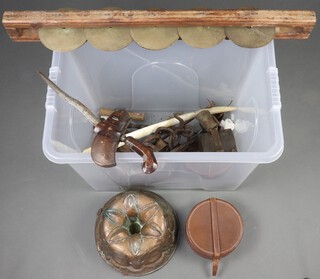 A large copper jelly mould, an Indian musical instrument and a collection of metalware all contained in a plastic crate