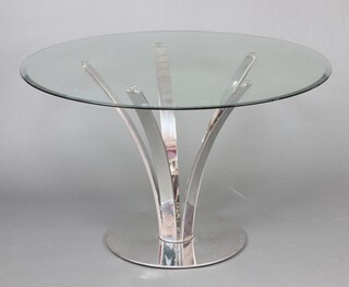 A circular plate glass and chrome dining table 75cm x 121cm 