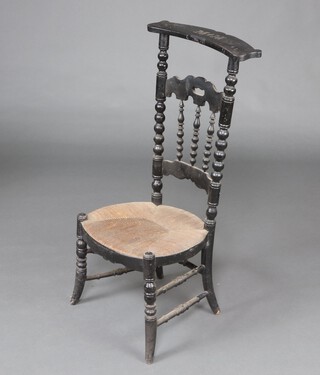 A 19th Century French ebonised Prie Dieu chair with woven rush seat, raised on turned supports 98cm h x 44cm w x 41cm d (seat 25cm x 20cm) 