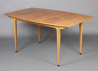 Mid-century, a McIntosh teak extending dining table with concealed extra leaf, raised on turned supports 74cm x 152cm x 91 together with 4 ladder back chairs 