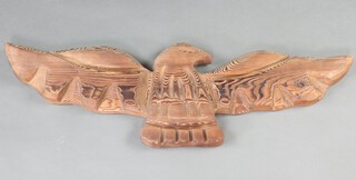 A North American carved wooden wall plaque in the form of an eagle in flight 92cm 