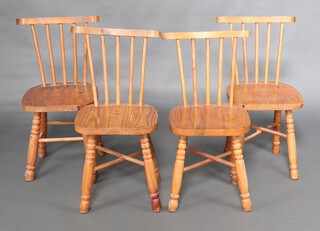 A set of 4 pine stick and rail back dining chairs, raised on turned supports with X framed stretchers 80cm h x 40cm w x 40cm d 